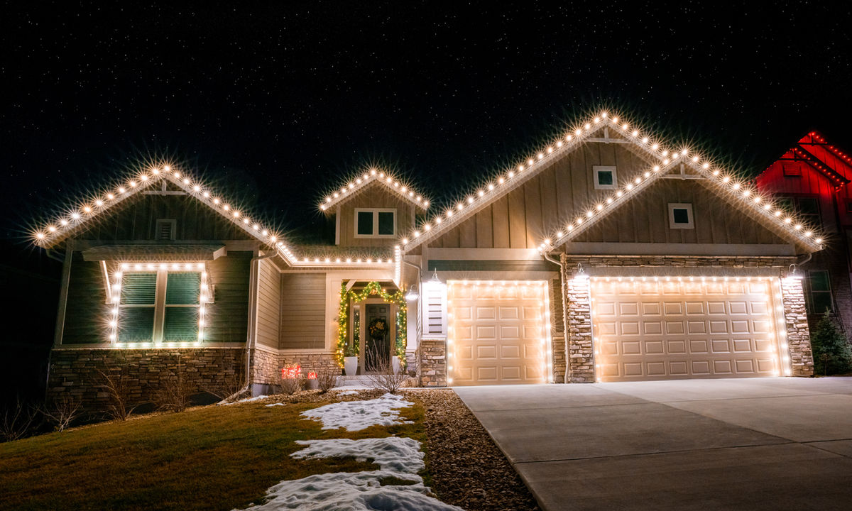 Warm white Christmas lights on residential home
