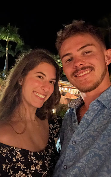 Two people smiling at outdoor event